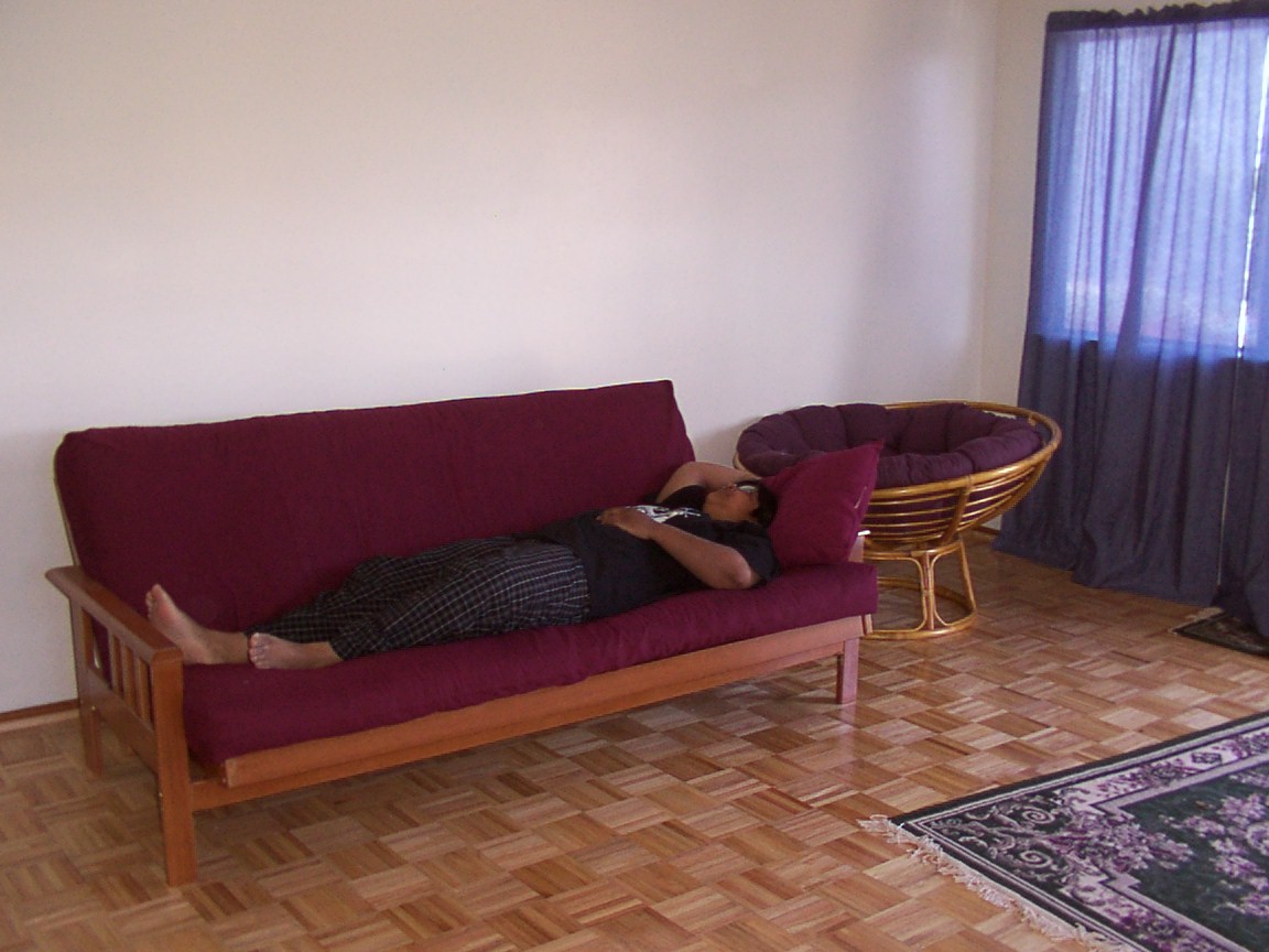 sharla lying on our futon